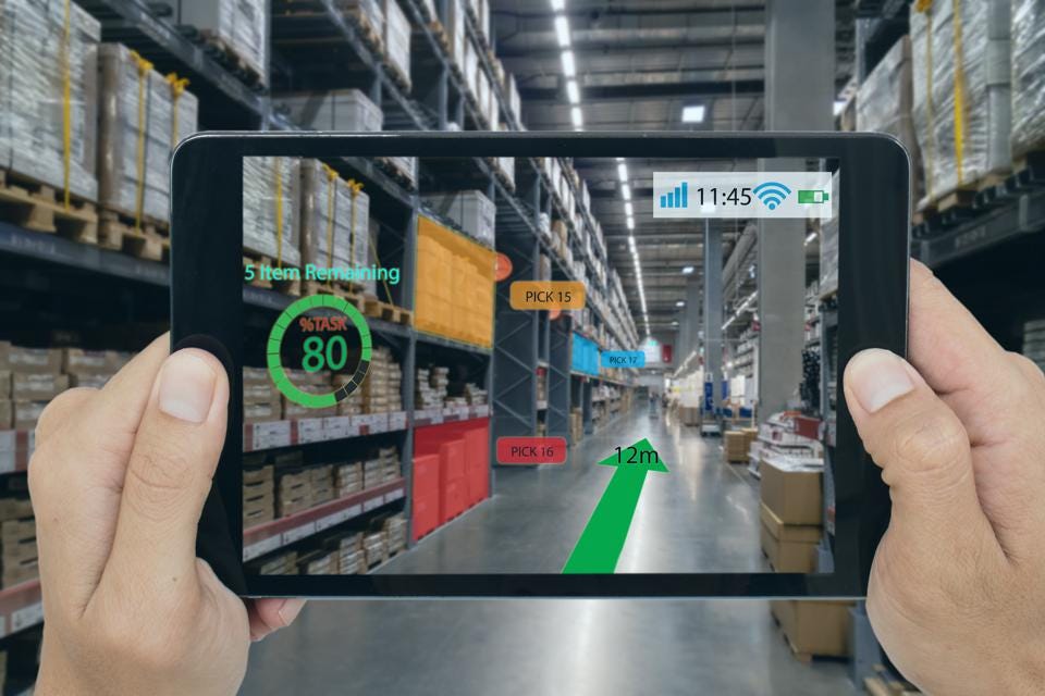 A photo of augmented reality on a tablet in a warehouse.