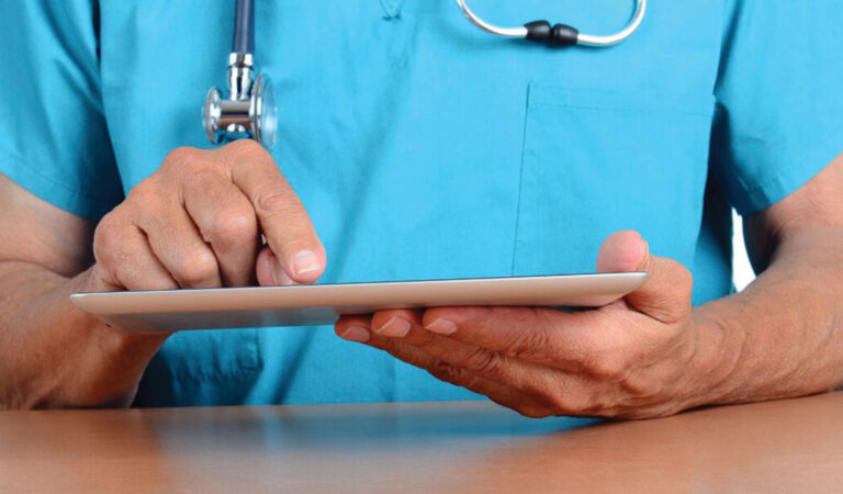 healthcare worker using an iPad