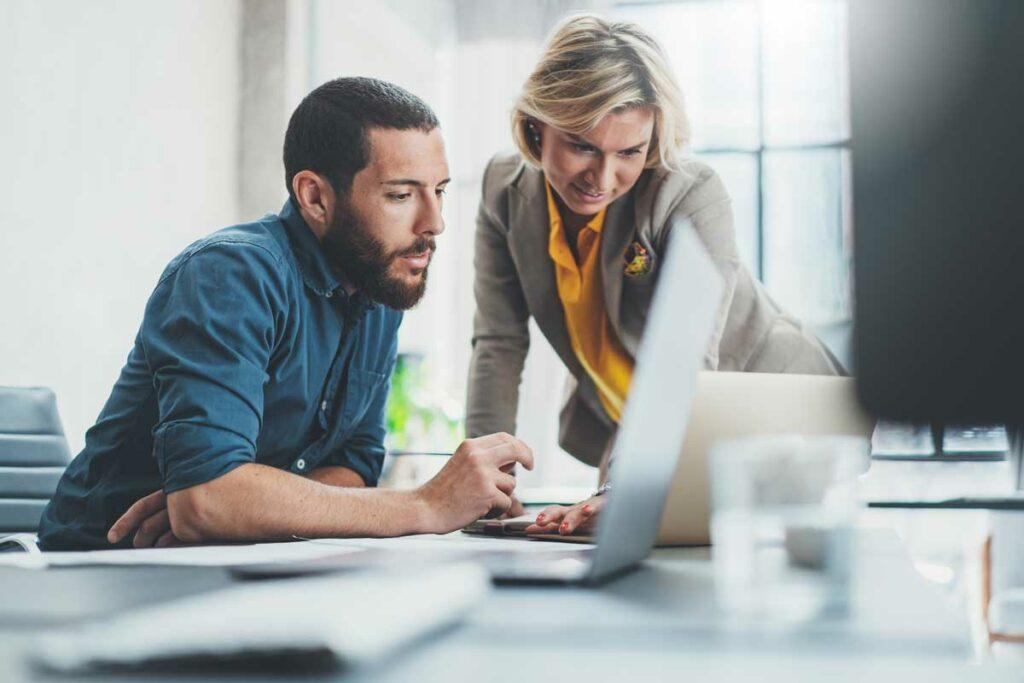 Two people working in a relaxed office.