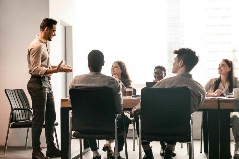 A diverse team gathered in a modern office for training.