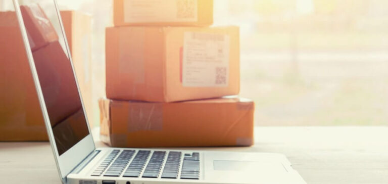 Laptop with boxes in the background